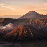 Mount Bromo with a landscape of Mount Semeru in the backgroud, a mountains in the Tengger Caldera.